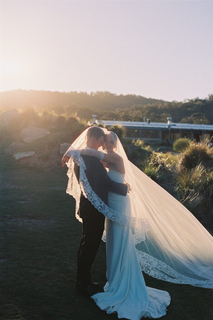 Alandra and Scott laughing during golden hour portraits at Tinkersfield Snowy Mountains NSW