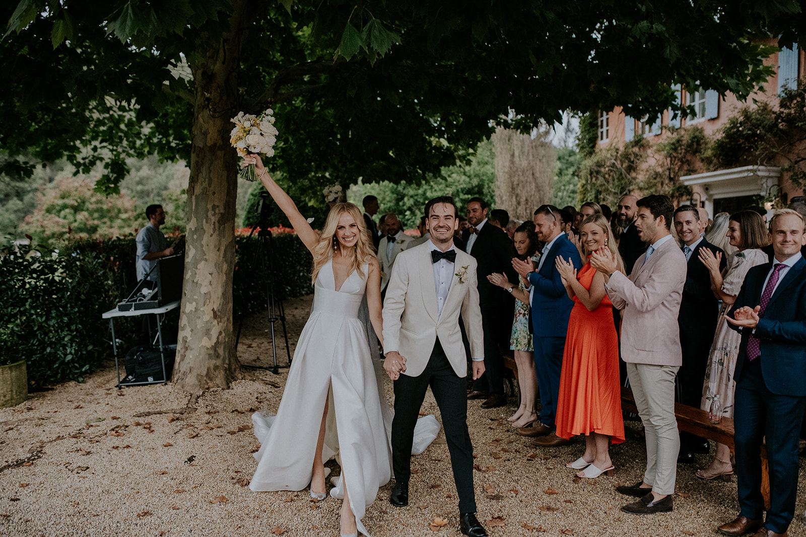 A bride and groom celebrate getting married at Redleaf by Sydney wedding photographer Scott Surplice