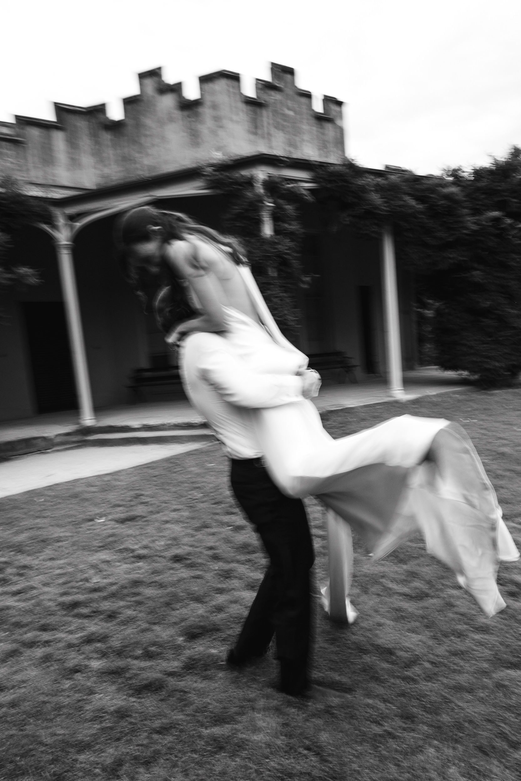 Relaxed portrait of couple on the lawn at Vaucluse house by Sydney wedding photographer